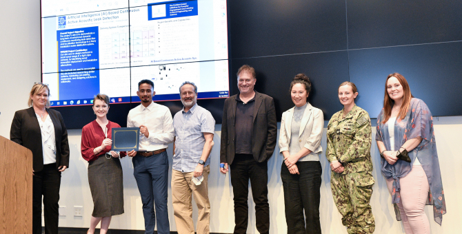 AI Leak Detection team receiving an award